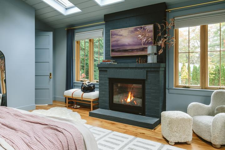 dark blue fireplace in bedroom