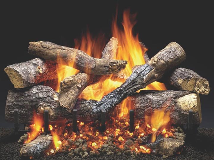 Heat & Glo Fireside Grand Oak vented log set with bold flames, semi-charred oak replica logs and glowing embers.