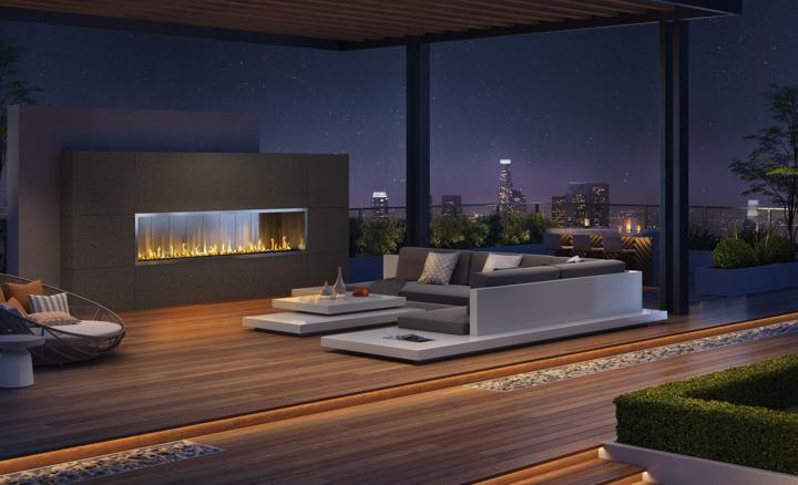 Stellar Custom Outdoor luxury fireplace in contemporary patio with low-profile furniture and city skyline views